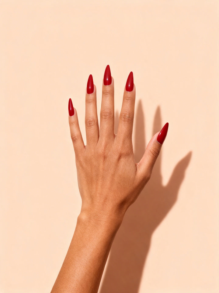 Cherry Red press-on nails on a hand