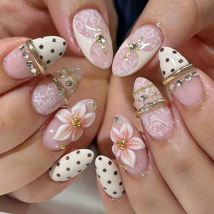Polka Dot Blossom Almond Press-On Nails on a hand
