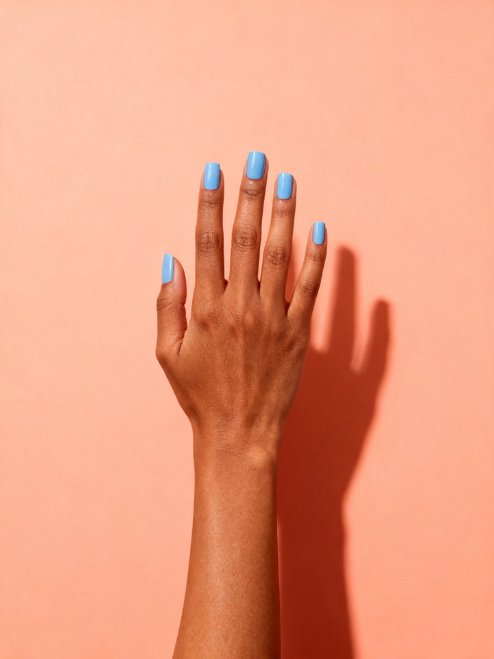 Sky Blue press-on nails on a hand