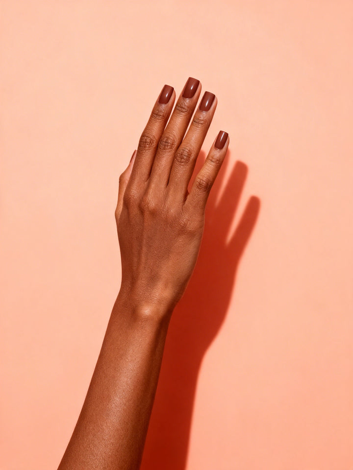 Chestnut Brown press-on nails on a hand