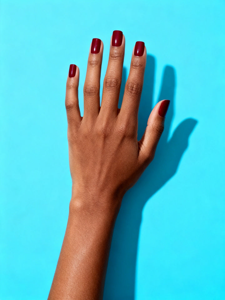 Classic Red press-on nails on a hand
