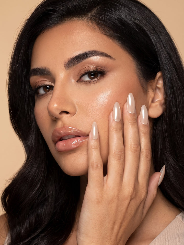 Champagne Pearl Chrome Almond Press-On Nails — model wearing the nails