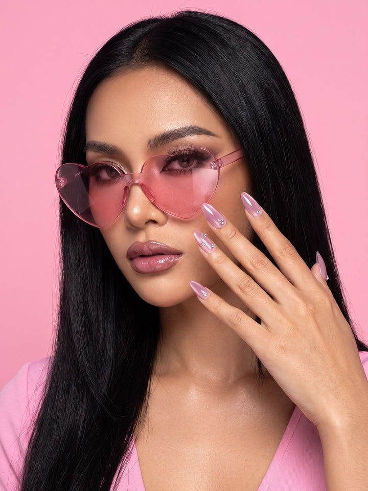 Pink Cat Eye Rhinestone Almond Press-On Nails — model wearing the nails