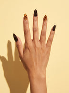 Tortoiseshell Espresso Almond Press-On Nails on a hand