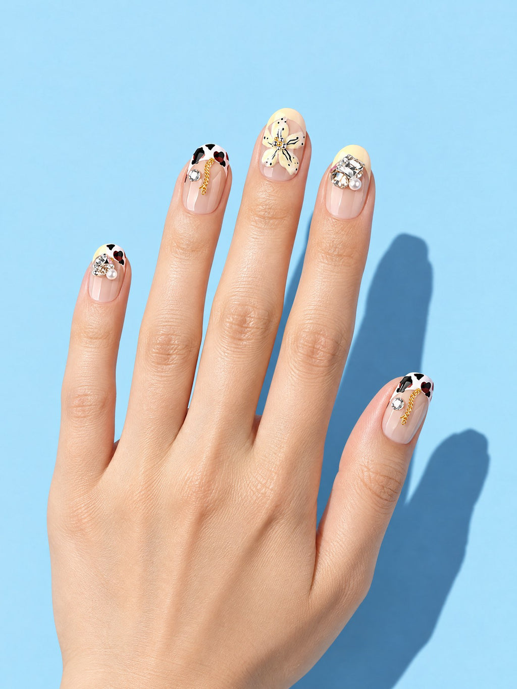 Buttercup Blossom Short Press-On Nails on a hand