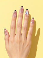 Mocha Butterfly Almond Press-On Nails on a hand