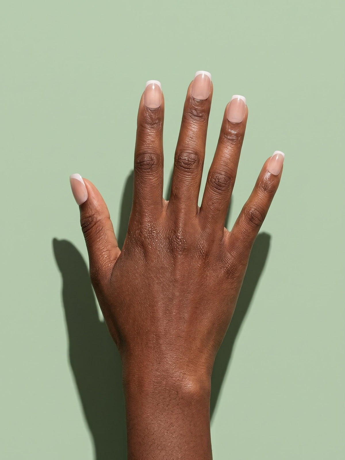 Nude Gradient French Short Square Press-On Nails on a hand