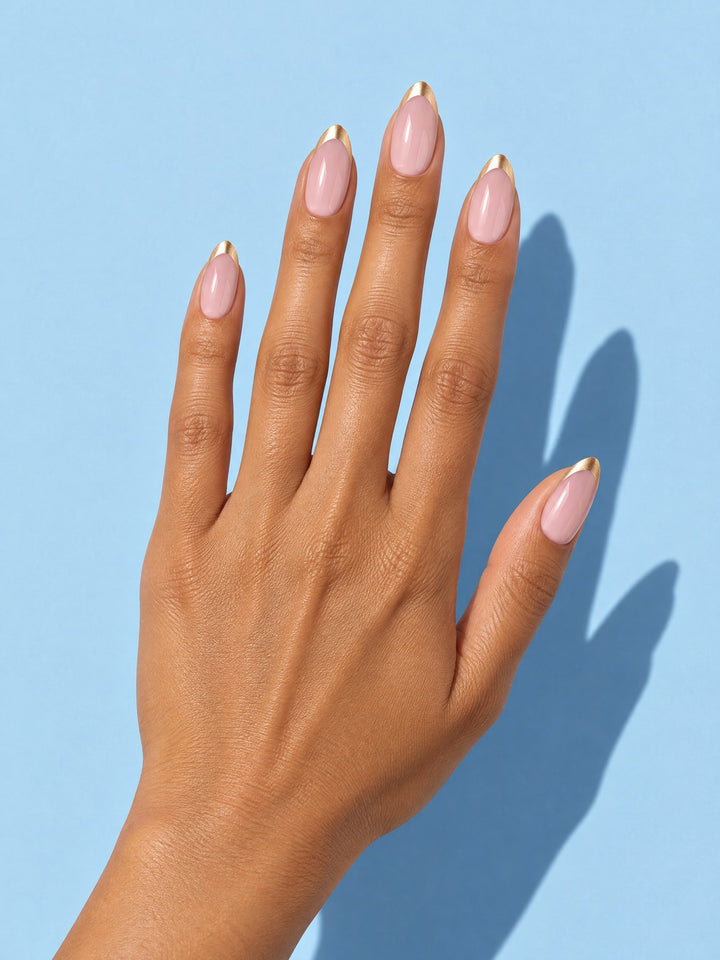 Gold Rim French Almond Press-On Nails on a hand