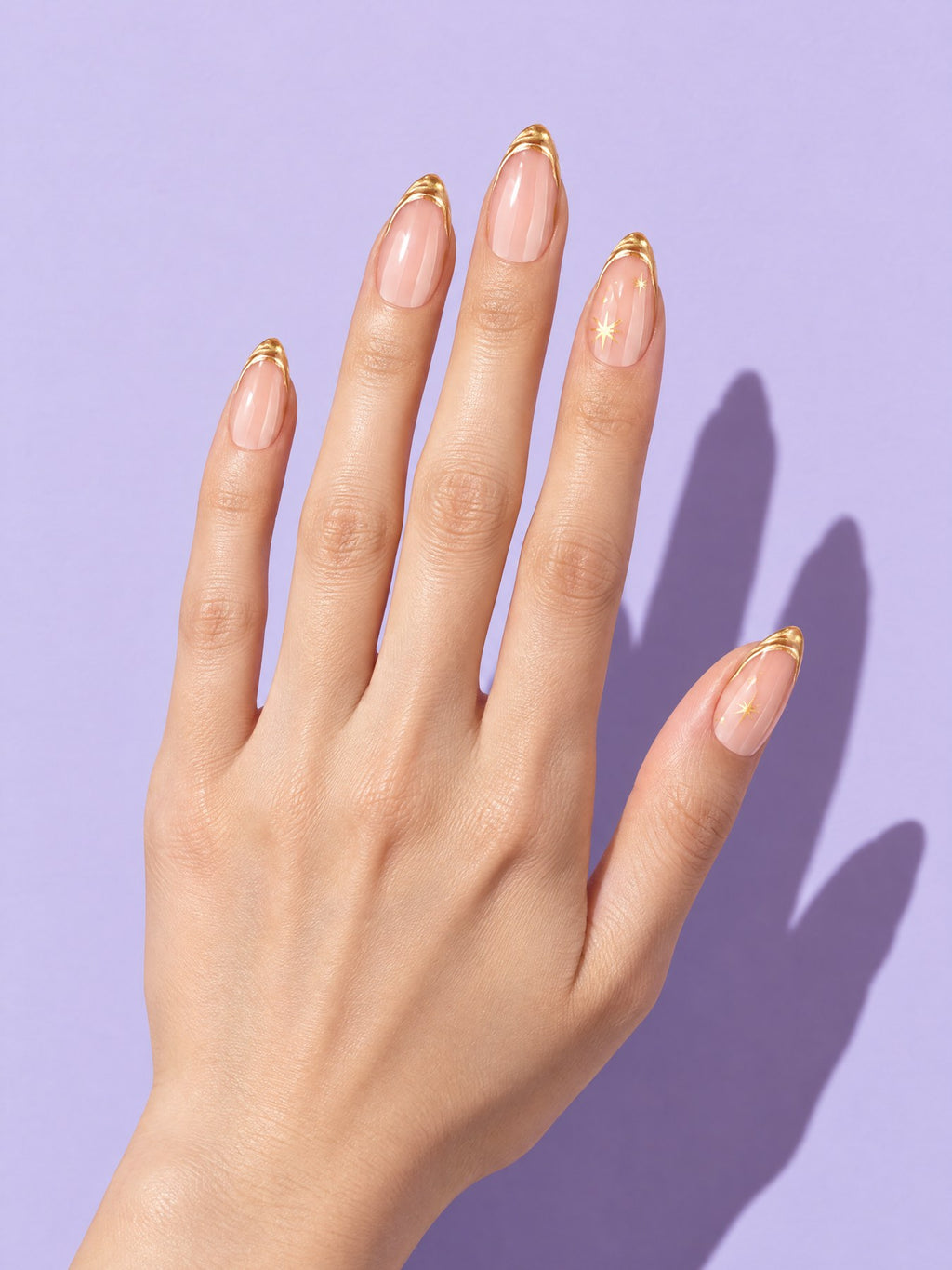 Gold Outline French Almond Press-On Nails on a hand