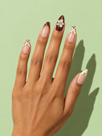 Leopard & Blossom French Almond Press-On Nails on a hand