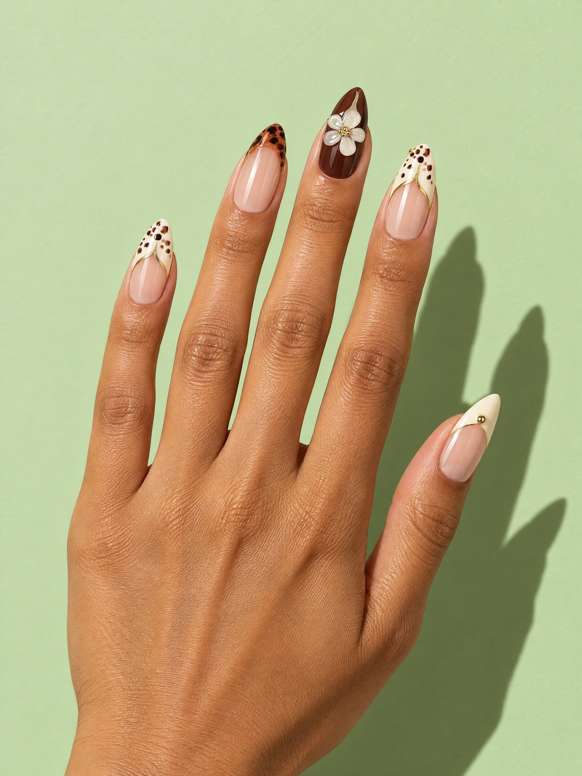 Leopard & Blossom French Almond Press-On Nails on a hand