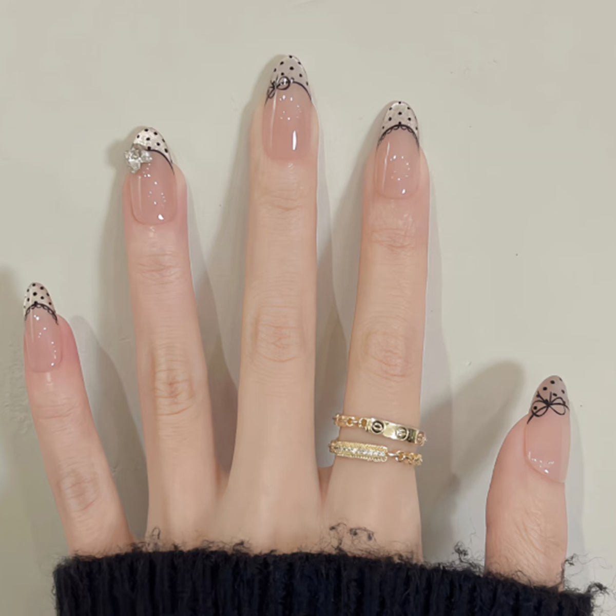 Black Dot French Almond Press-On Nails – nude with black polka-dot french tips and tiny bows, photo 4