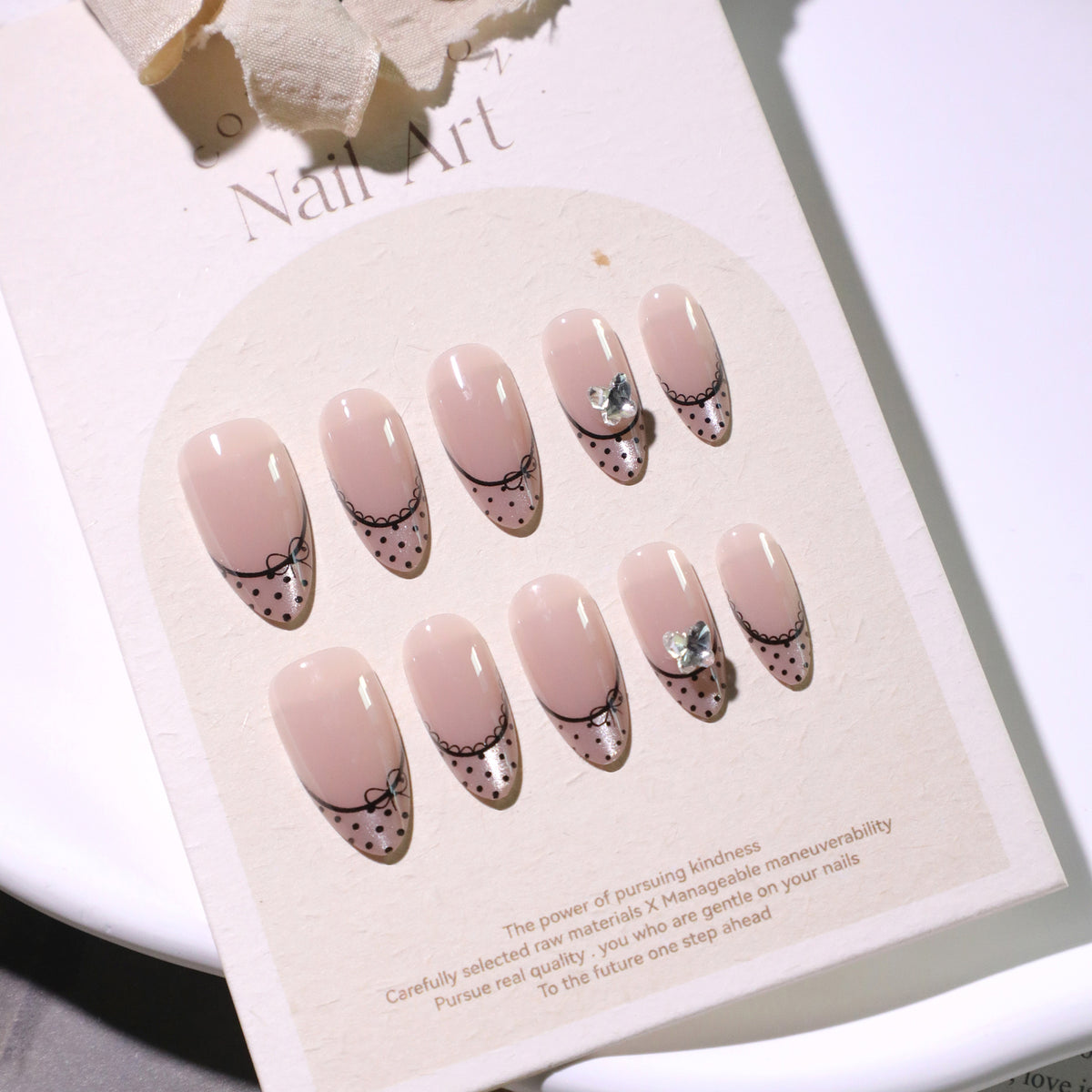 Black Dot French Almond Press-On Nails – nude with black polka-dot french tips and tiny bows, photo 5