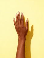 Latte Beige press-on nails on a hand