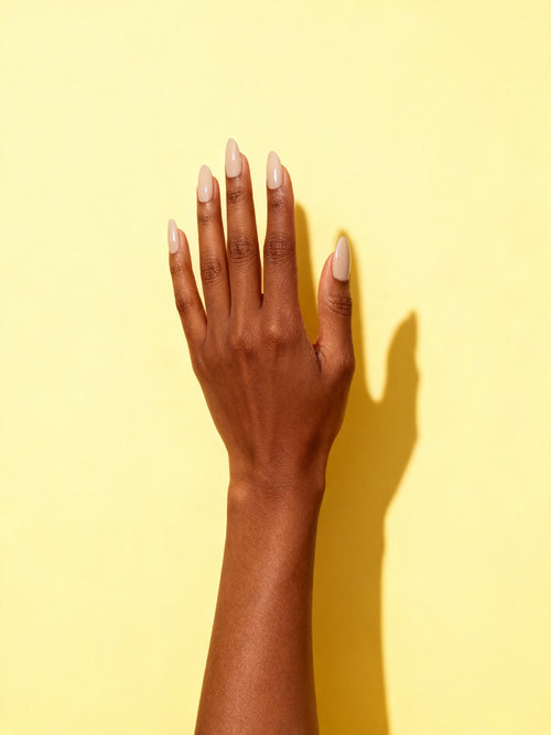Latte Beige press-on nails on a hand