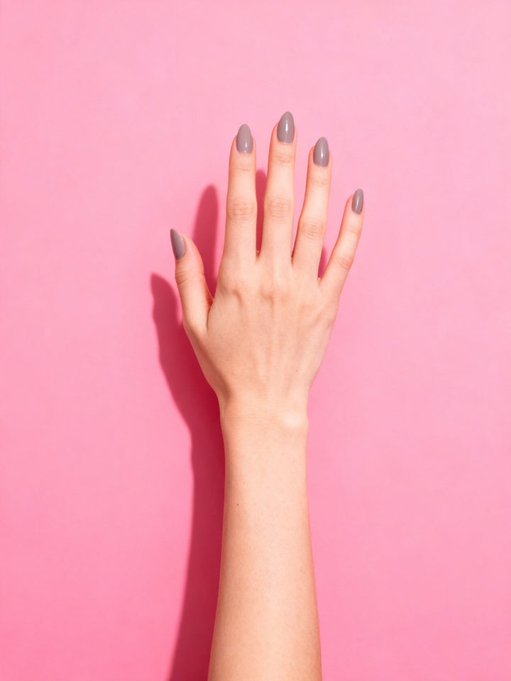 Taupe Grey press-on nails on a hand