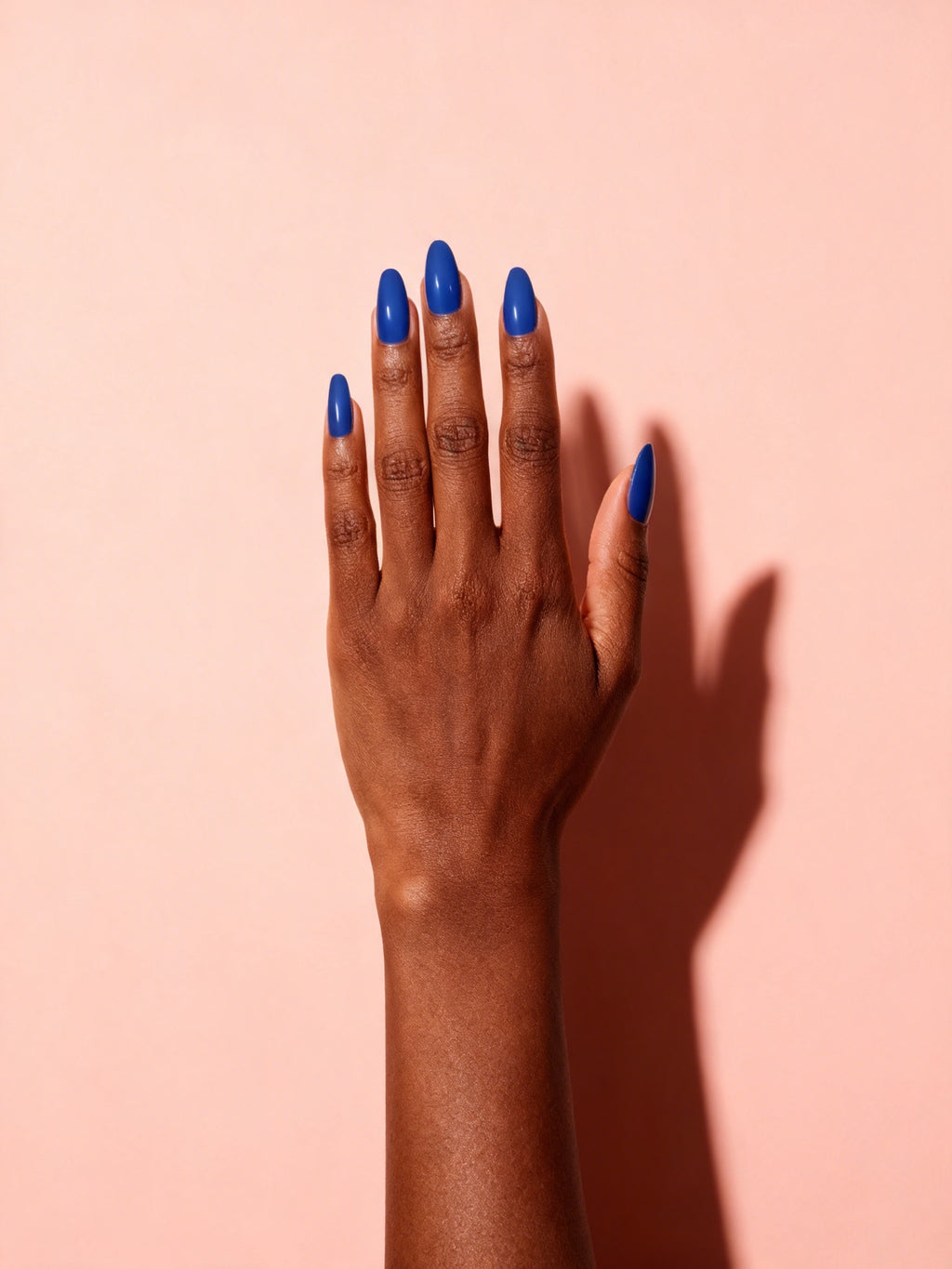 Cobalt Blue press-on nails on a hand