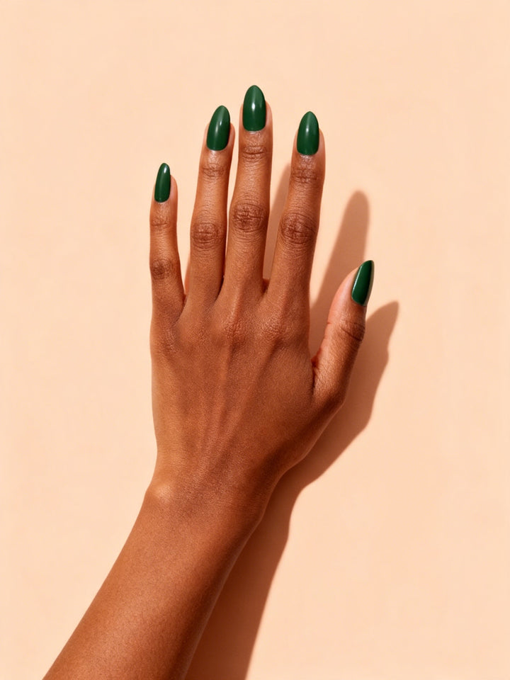 Forest Green press-on nails on a hand