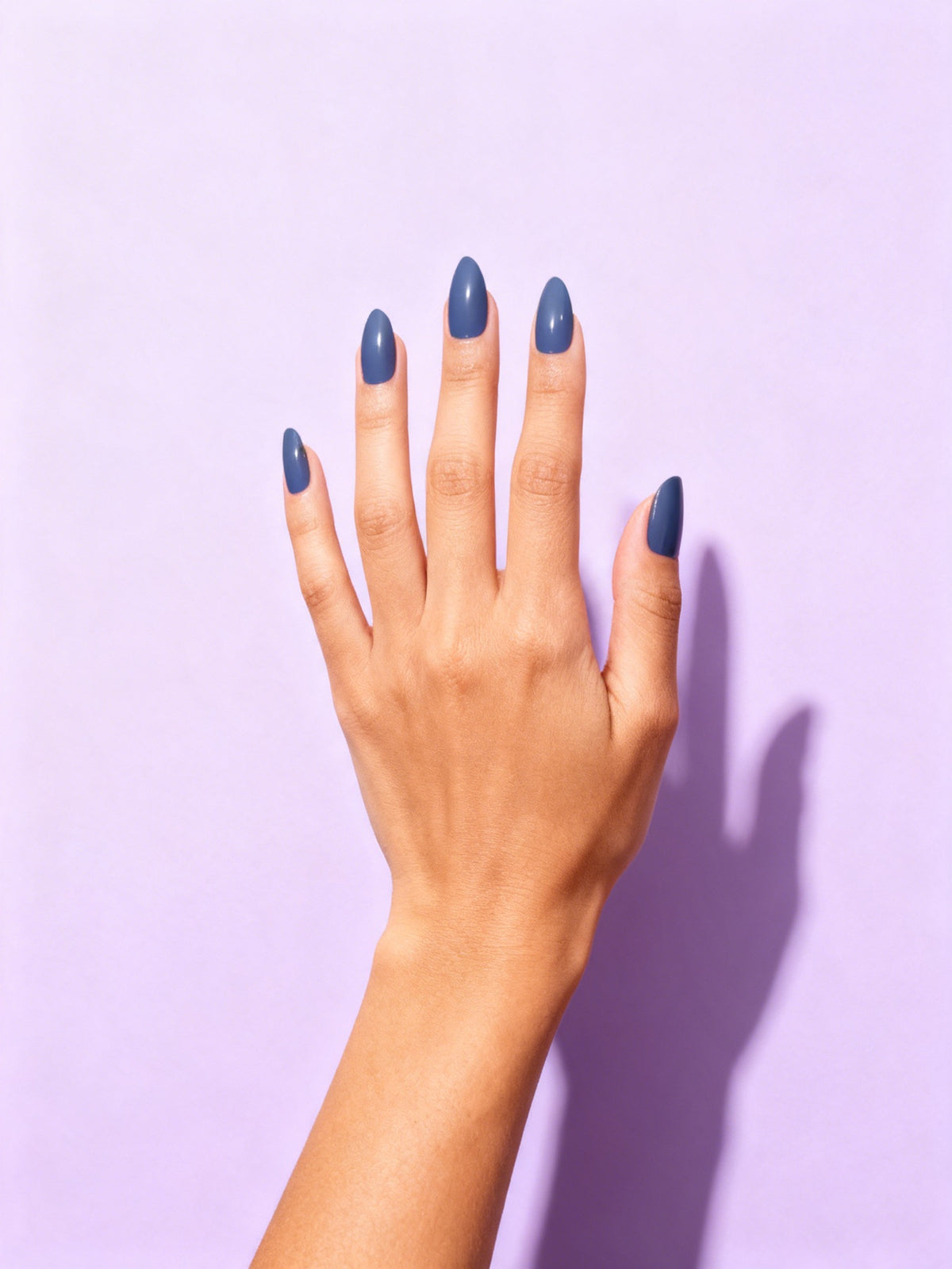 Slate Blue press-on nails on a hand