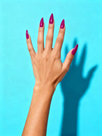 Berry Magenta press-on nails on a hand