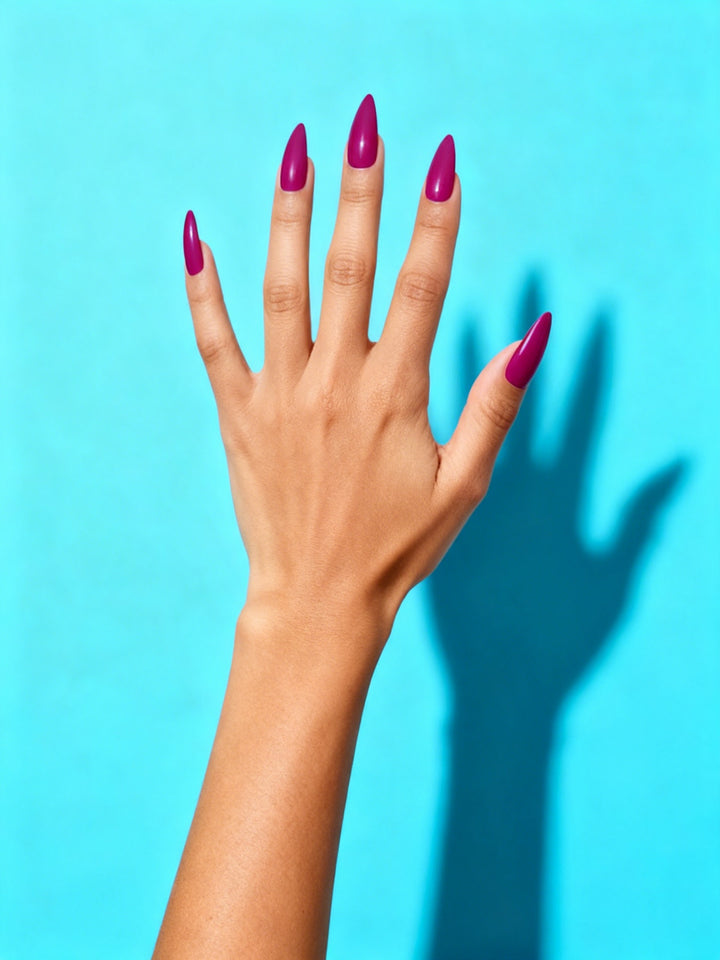 Berry Magenta press-on nails on a hand