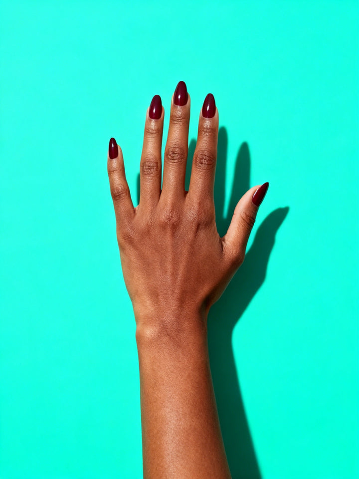 Wine Red press-on nails on a hand