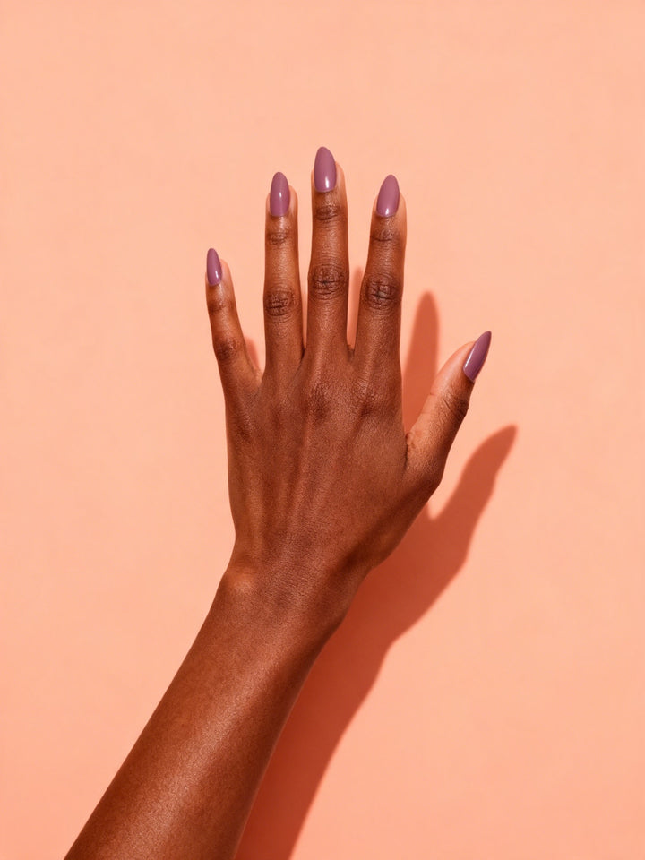 Dusty Mauve press-on nails on a hand