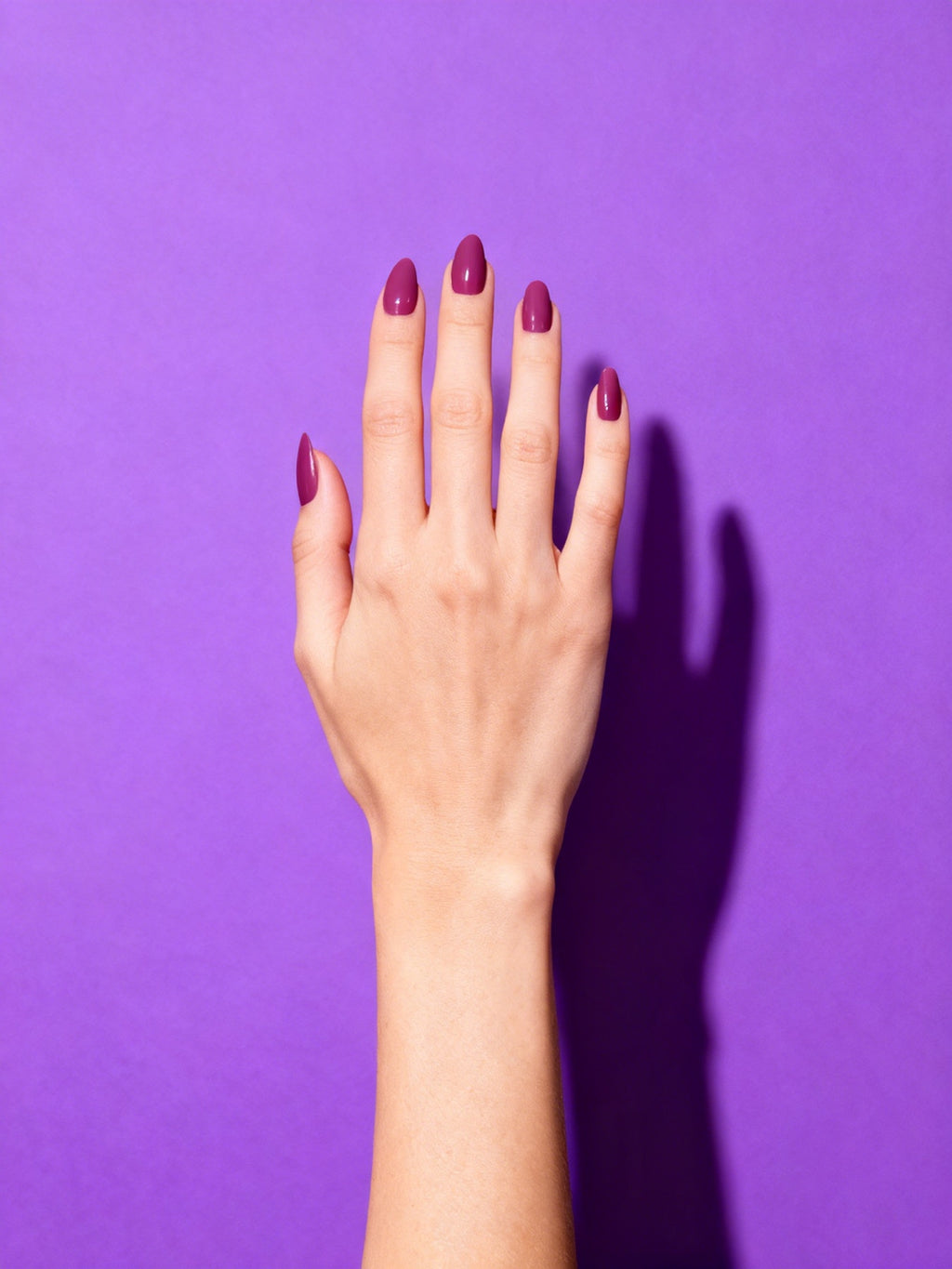 Plum Rose press-on nails on a hand