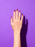 Plum Rose press-on nails on a hand