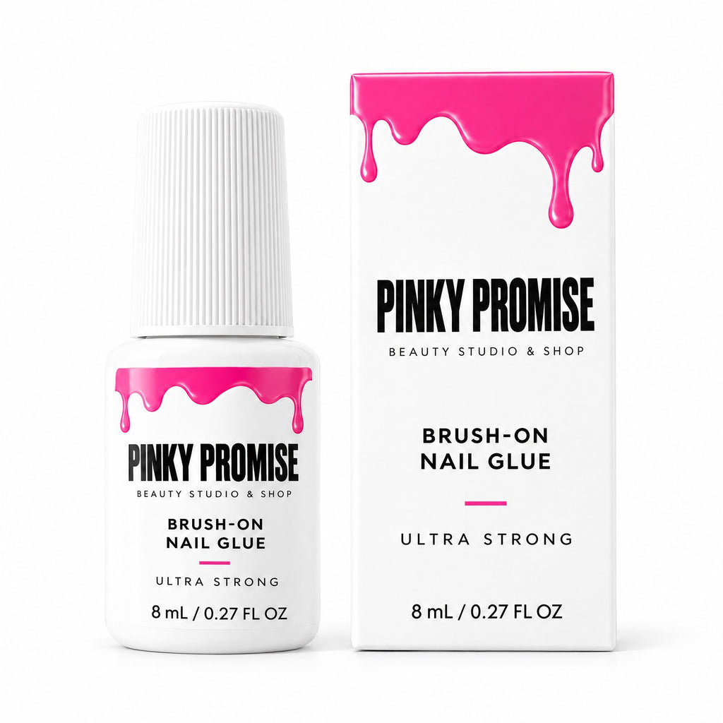 Pinky Promise brush-on nail glue bottle and box on white