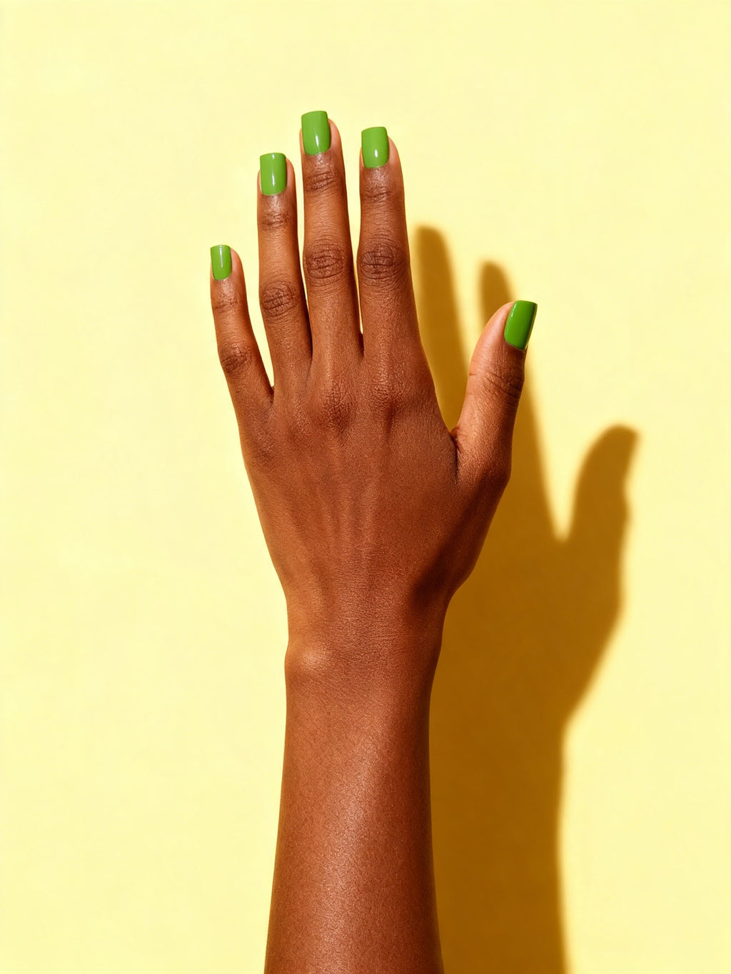 Apple Green press-on nails on a hand