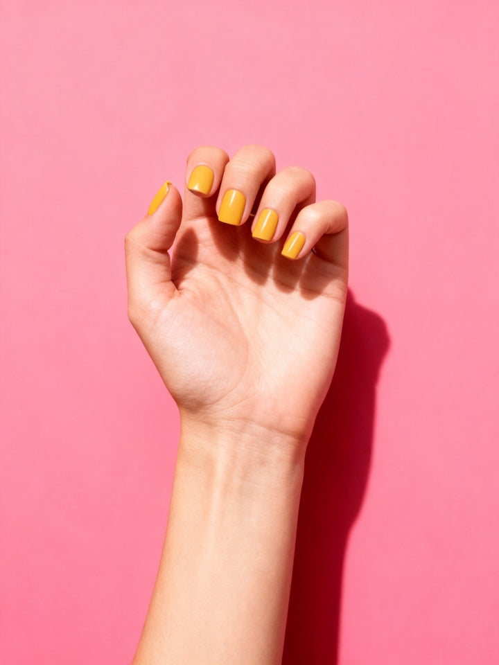Sunflower Yellow press-on nails on a hand