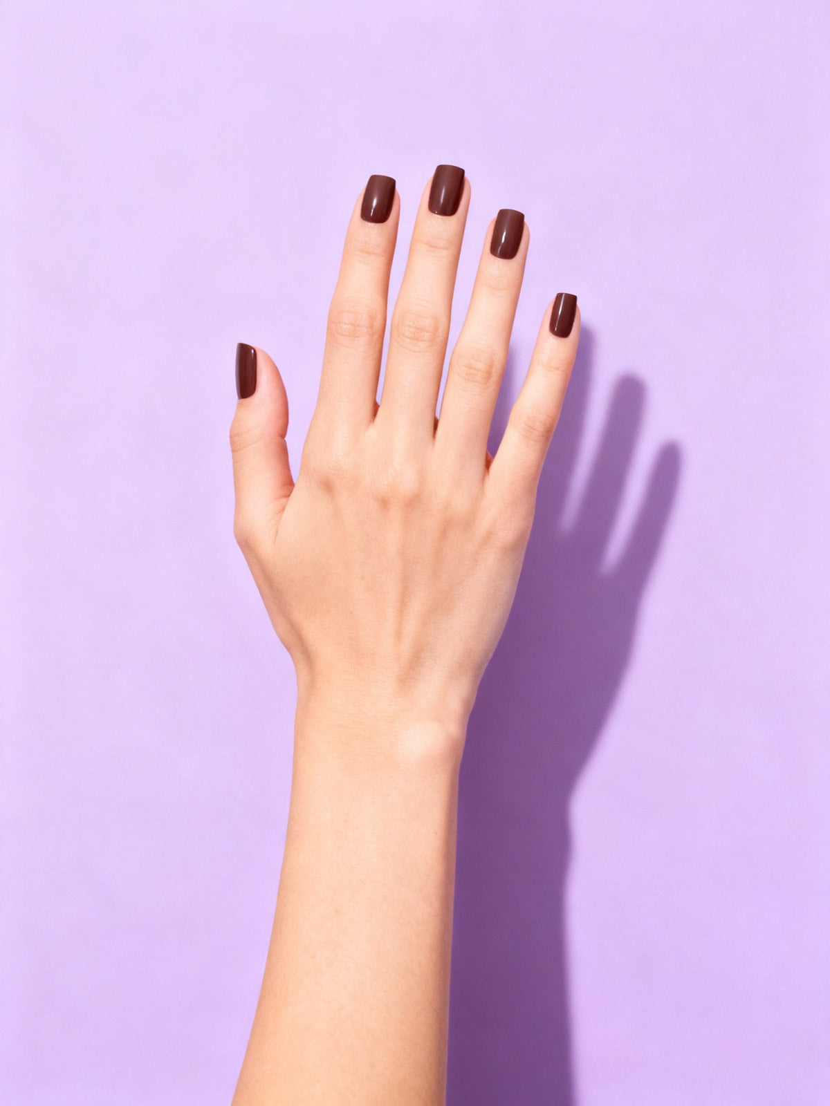 Espresso press-on nails on a hand