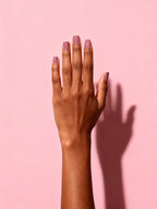 Dusty Rose press-on nails on a hand