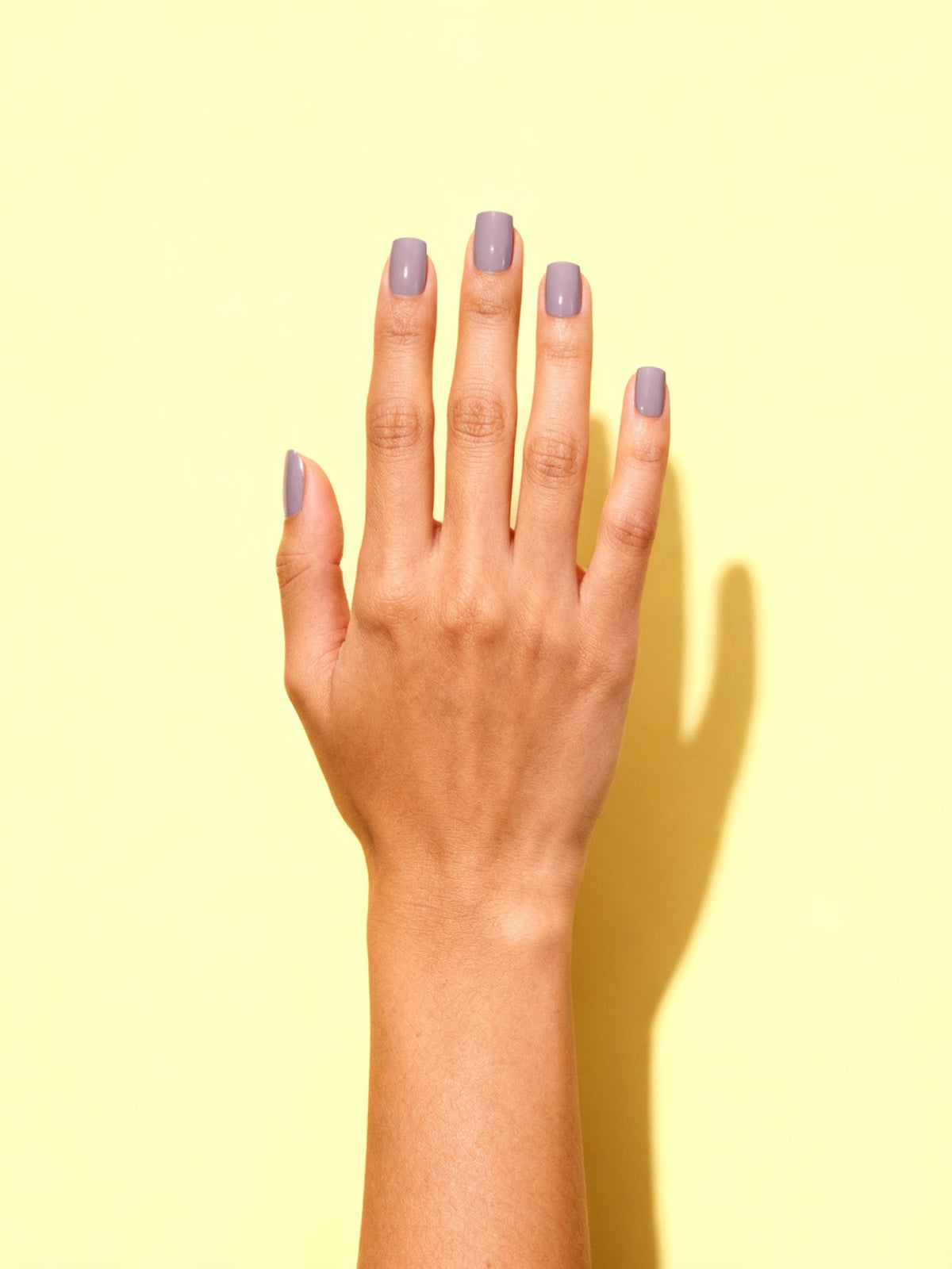Lavender Grey press-on nails on a hand