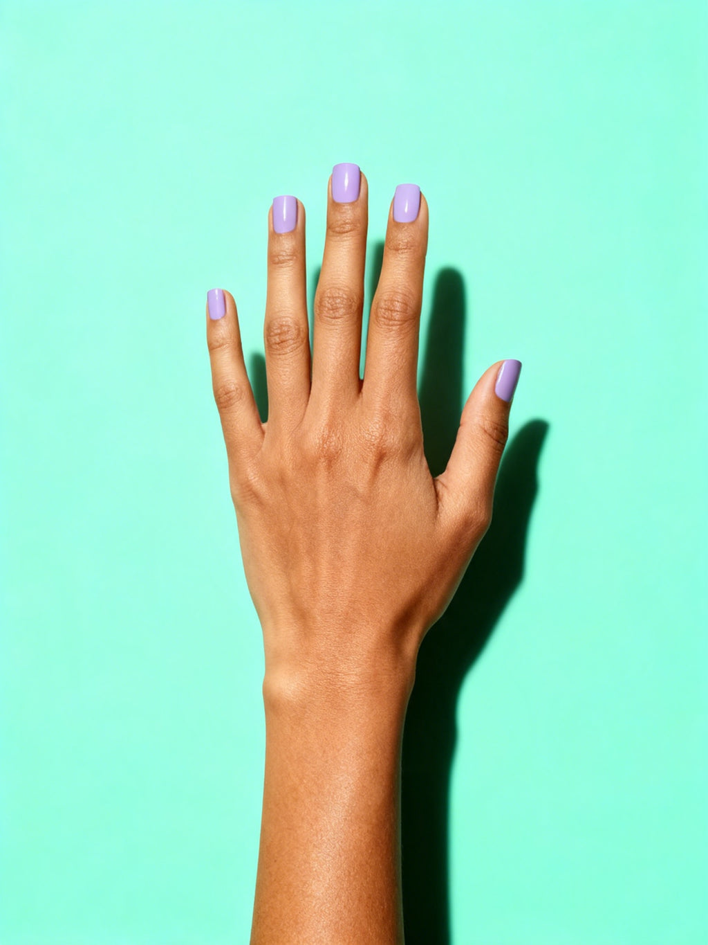 Lilac press-on nails on a hand