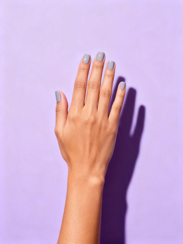 Dove Grey press-on nails on a hand