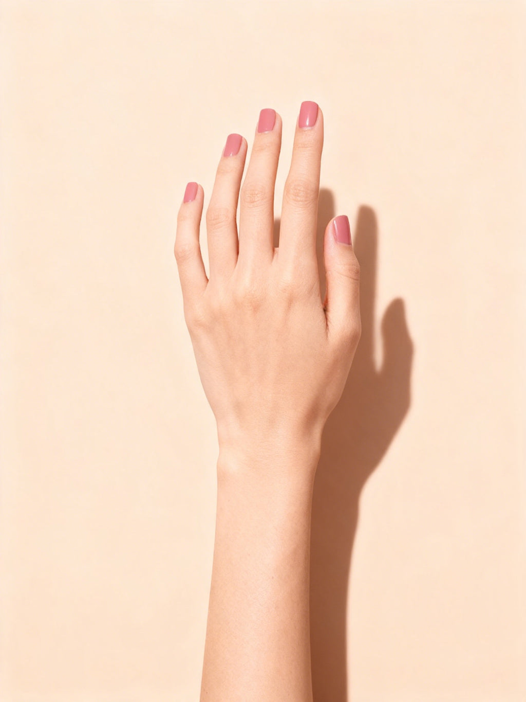 Rose Jelly press-on nails on a hand