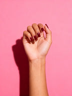 Cherry Burgundy press-on nails on a hand