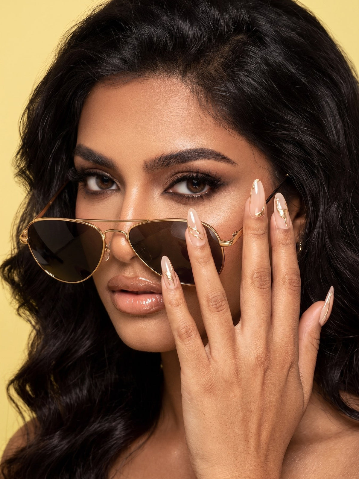 Gold Swirl Chrome Stiletto Press-On Nails — model wearing the nails
