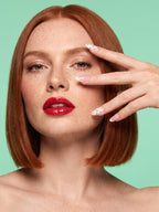 Red Polka Dot Almond Press-On Nails — model wearing the nails