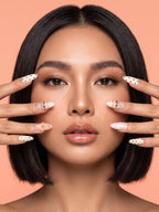 Polka Dot Bow & Blossom Almond Press-On Nails — model wearing the nails
