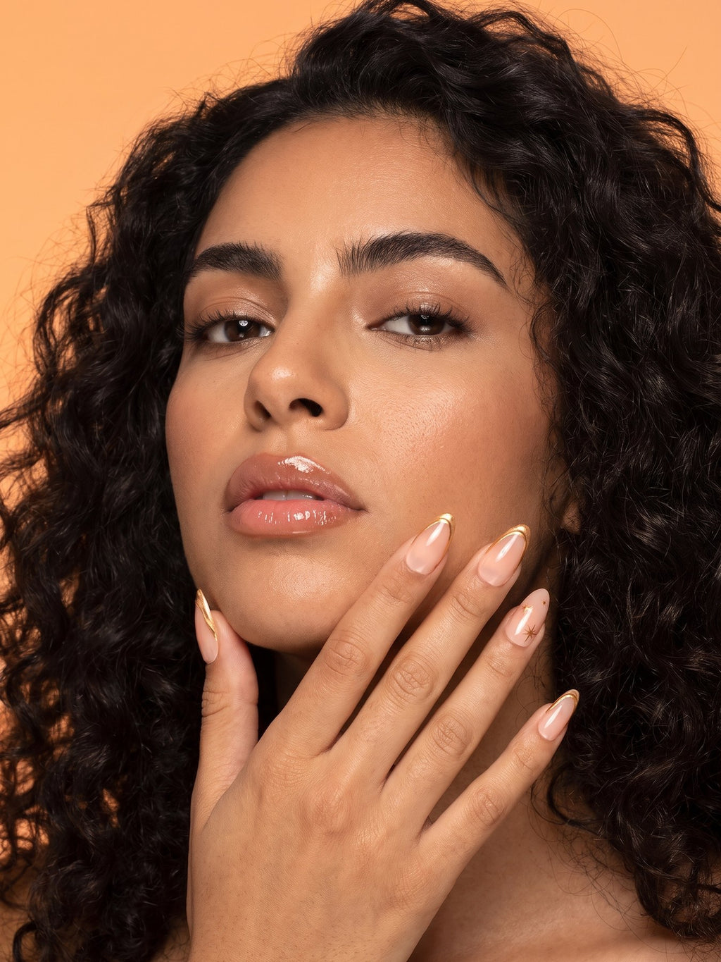 Gold Outline French Almond Press-On Nails — model wearing the nails