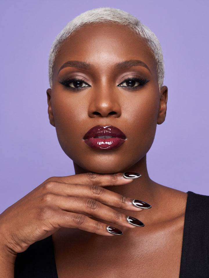 Black Cherry Gold Rim Almond Press-On Nails — model wearing the nails