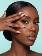 Black Dot French Almond Press-On Nails — model wearing the nails