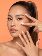Sunset Floral French Almond Press-On Nails — model wearing the nails